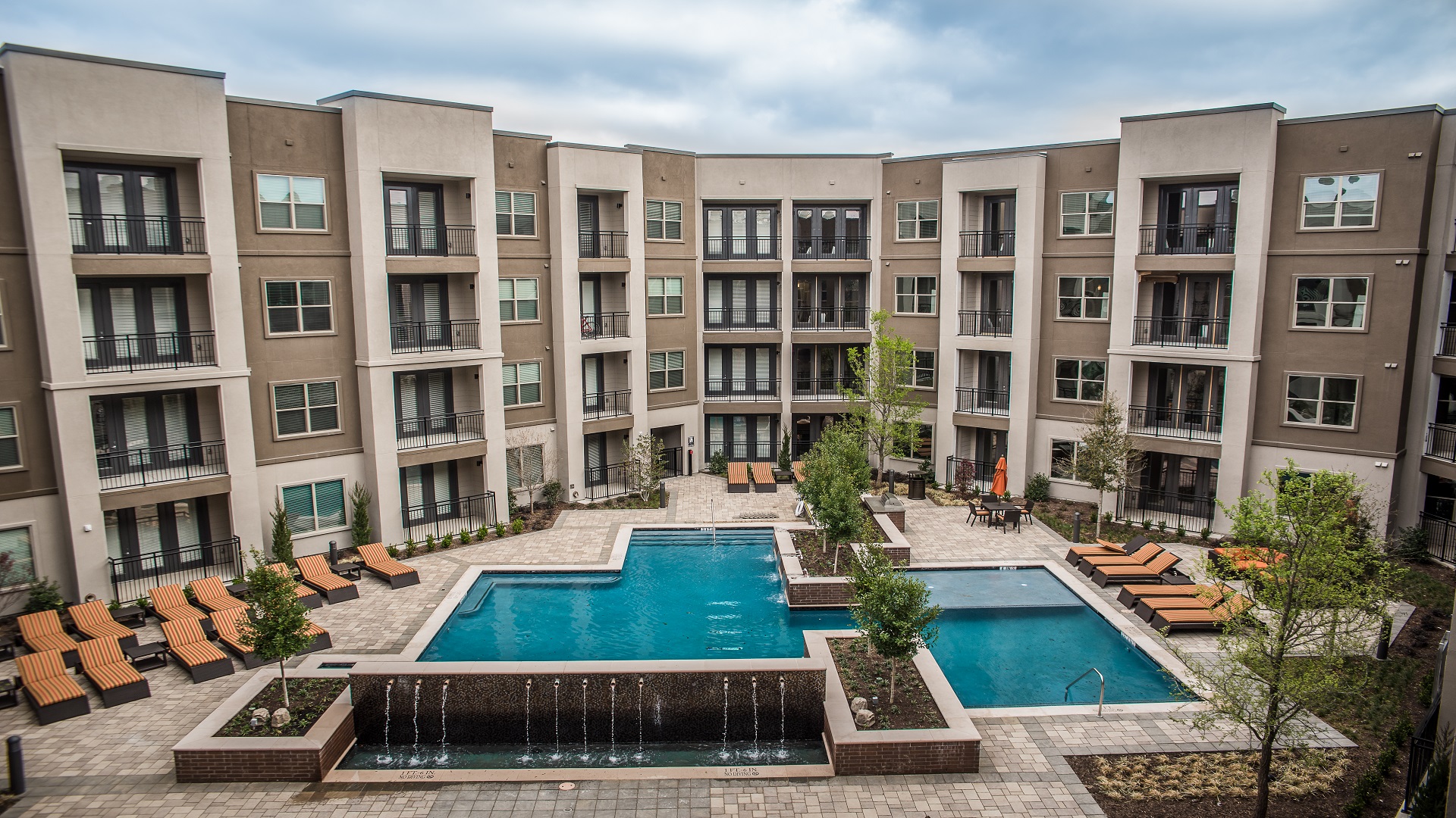 Multi-family apartment complex with courtyard and pool